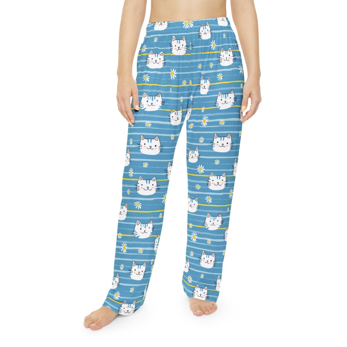 Blue pajama pants with a seamless print of cute cat faces and white daisies on horizontal stripes.