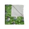 Cozy fleece blanket featuring a seamless all over print of cute cartoon donkeys sitting in green grass with white daisies. Perfect for children.