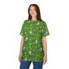 Cute gray donkey all over print sublimation tee on green grass with white flowers. Kawaii cartoon animal graphic.