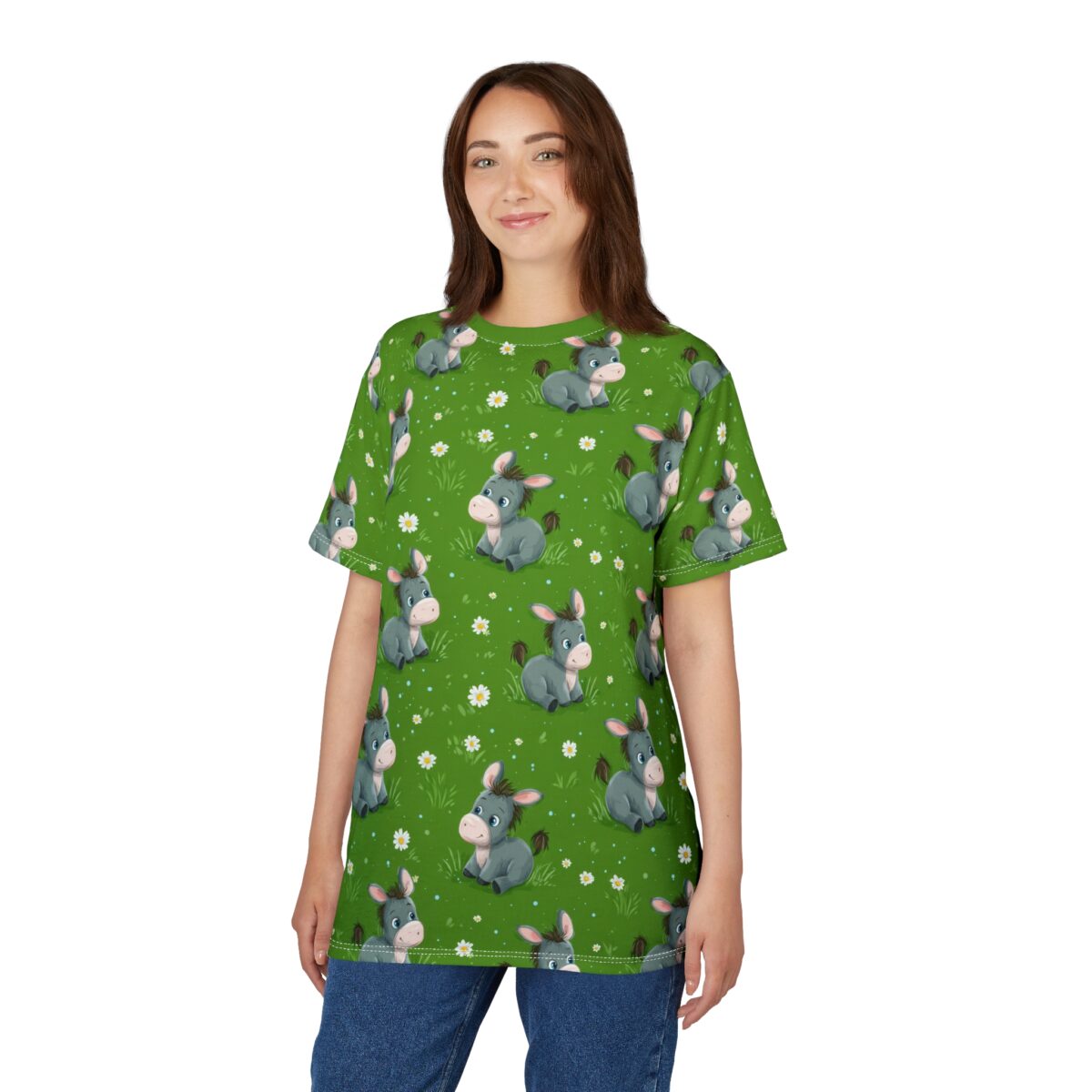 Cute gray donkey all over print sublimation tee on green grass with white flowers. Kawaii cartoon animal graphic.