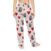 Cute grey mouse holding a red heart graphic on light grey pajama pants with scattered red hearts.