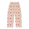 Cute white mouse holding a red heart graphic on light pink pajama pants with a repeating heart pattern.