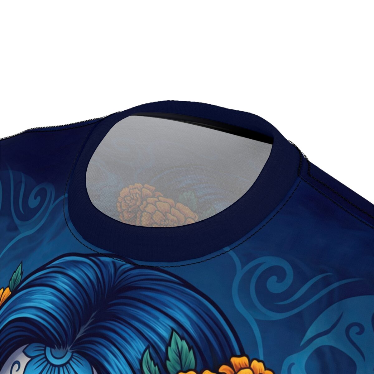 All over print sublimation tee featuring a blue-haired Day of the Dead skull with orange flowers and swirling blue patterns.