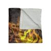 Sugar skull woman with sunflower crown throw blanket featuring vibrant fire aesthetic and ultra-soft white fleece lining.