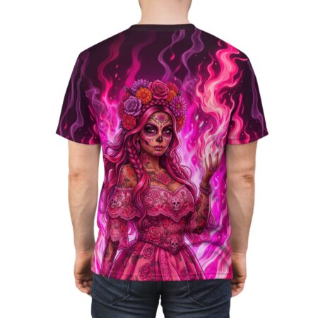 All over print sublimation tee featuring a vibrant pink Day of the Dead woman with intricate sugar skull makeup and fiery pink flames.