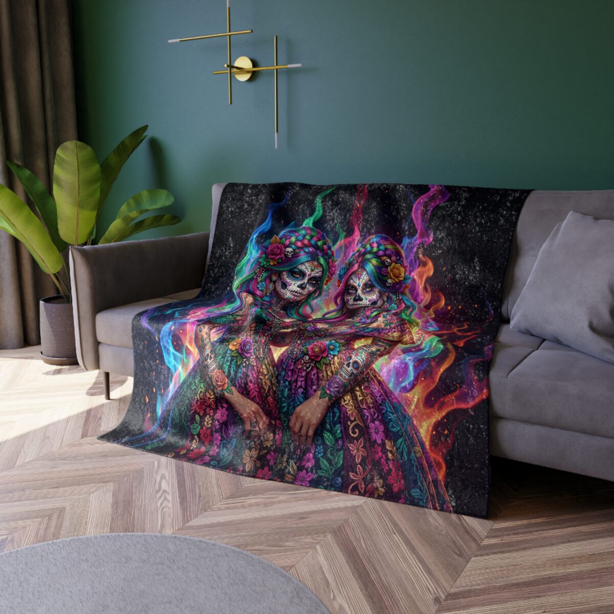 Fleece blanket with two sugar skull women embracing, surrounded by colorful flames and floral patterns. Features a vibrant Day of the Dead design.