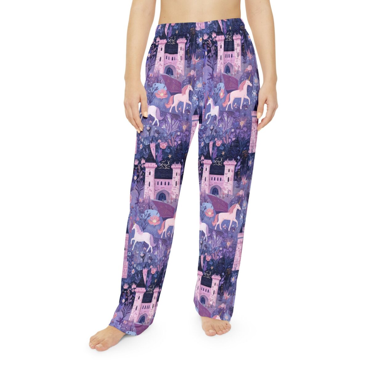 Purple all over print pajama pants featuring unicorns, fantasy castles, and magical flora. Seamless sublimation tee design.
