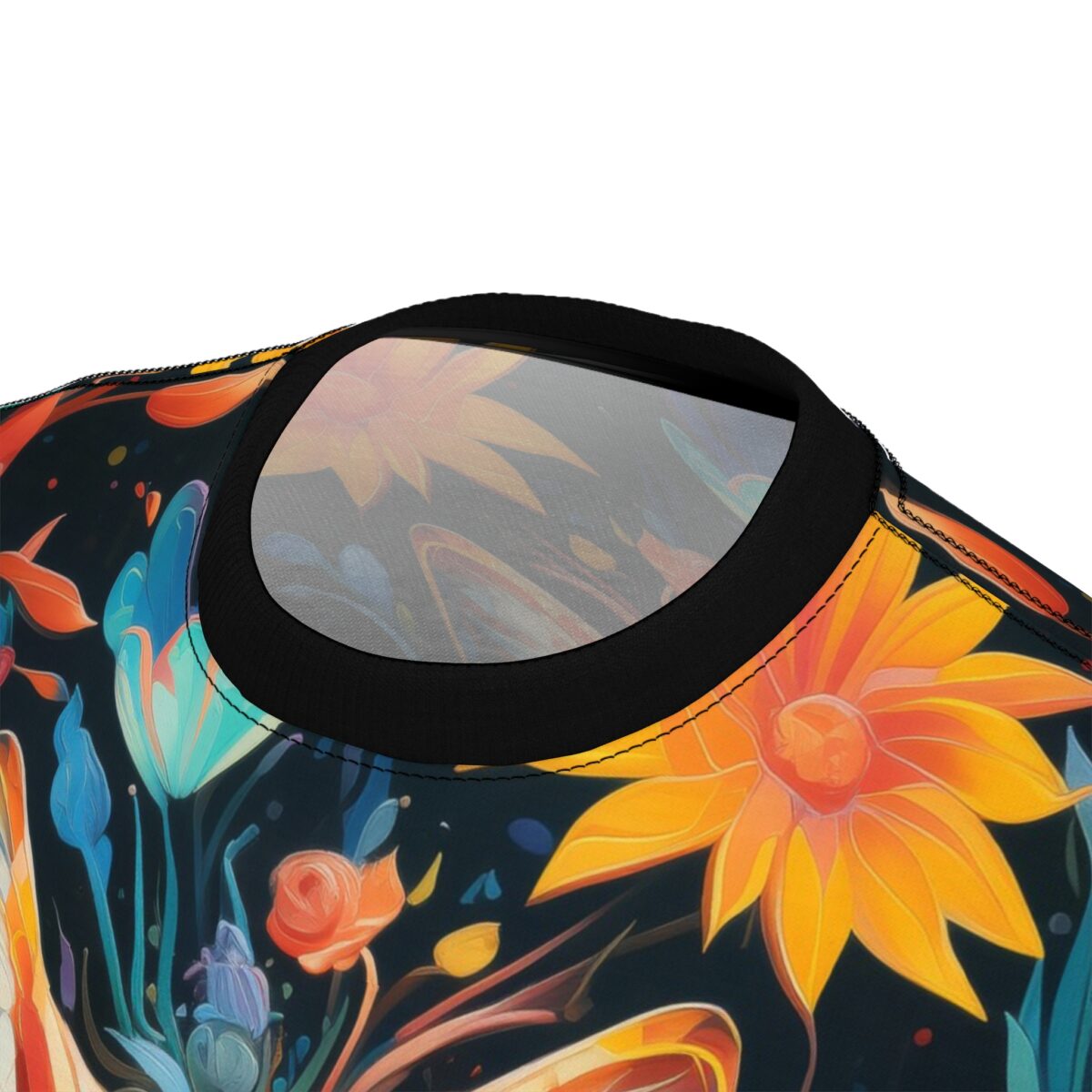 Vibrant floral all over print sublimation tee featuring large orange sunflowers and blue tulip-like flowers on a dark background.
