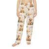 Cream pajama pants with an all over print of golden retriever puppies and kittens playing in lavender fields with clouds.