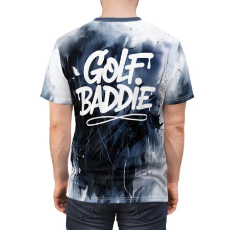 All over print sublimation tee featuring white 'Golf. Baddie' graffiti on a dark abstract paint splatter graphic.