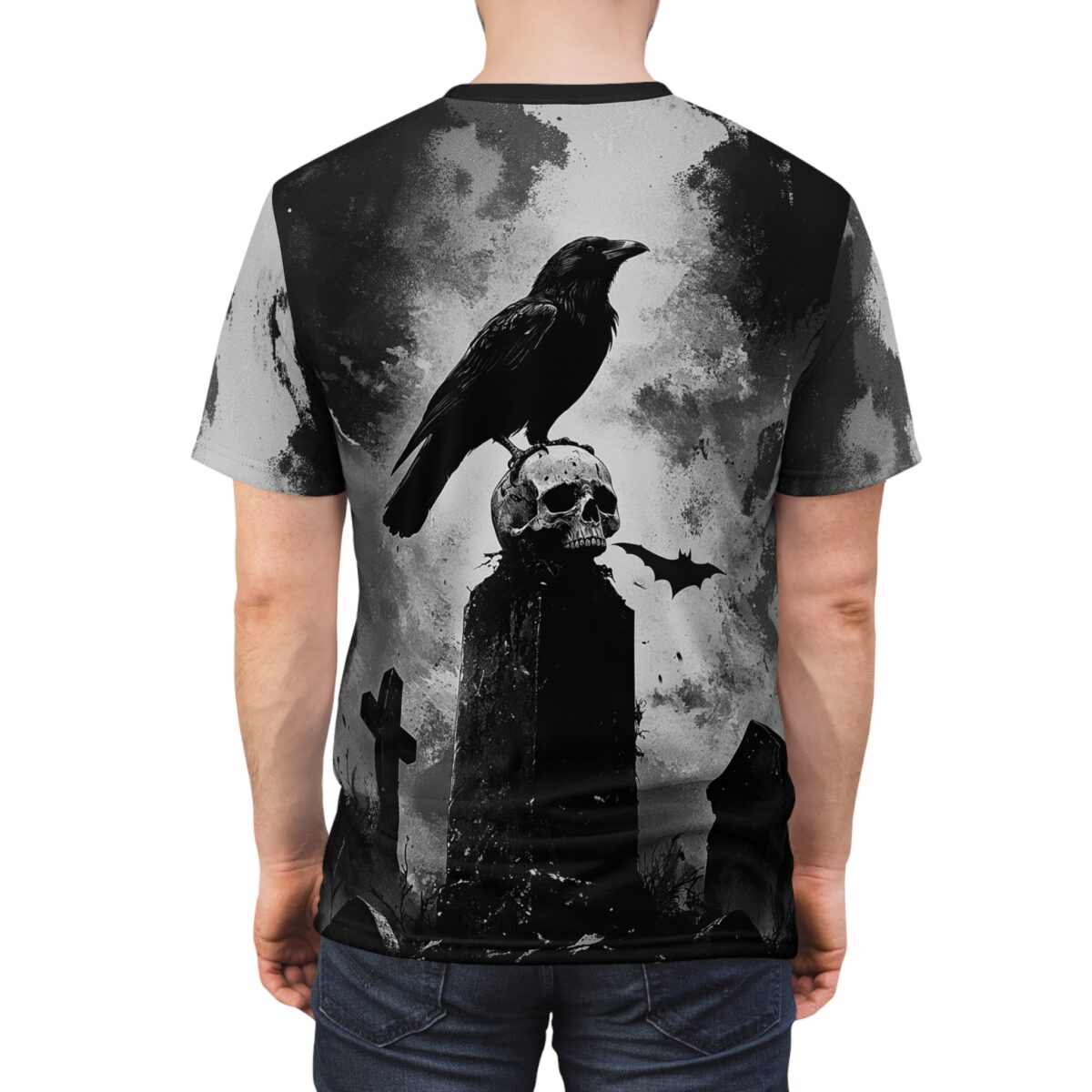 Gothic all over print t-shirt featuring a raven perched on a skull in a graveyard with a bat flying.