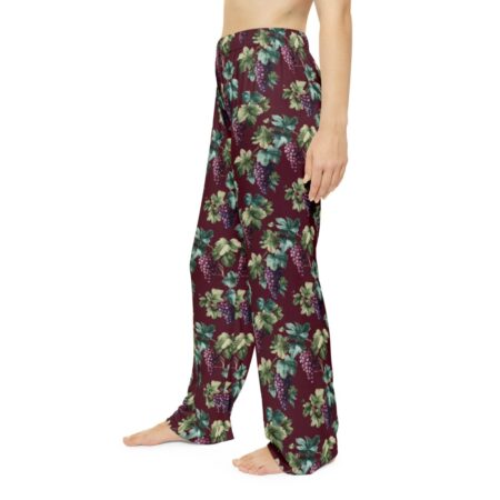 Burgundy pajama pants with a seamless all over print of green grape leaves and purple grapes.