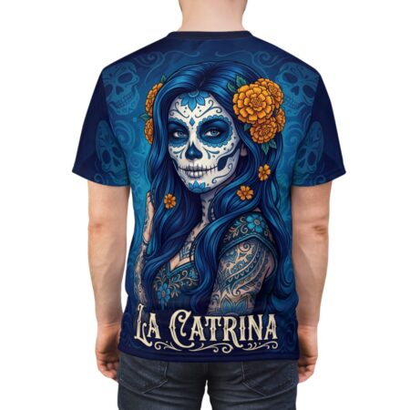 All over print sublimation tee featuring a La Catrina sugar skull portrait with blue hair, orange flowers, and intricate Day of the Dead motifs.