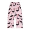 Pink pajama pants with all over print of black bats, pink spheres, and small stars. Seamless wrap around graphic design.