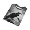 All over print sublimation tee with a detailed raven perched on a cracked skull, surrounded by flying bats and cloudy skies.