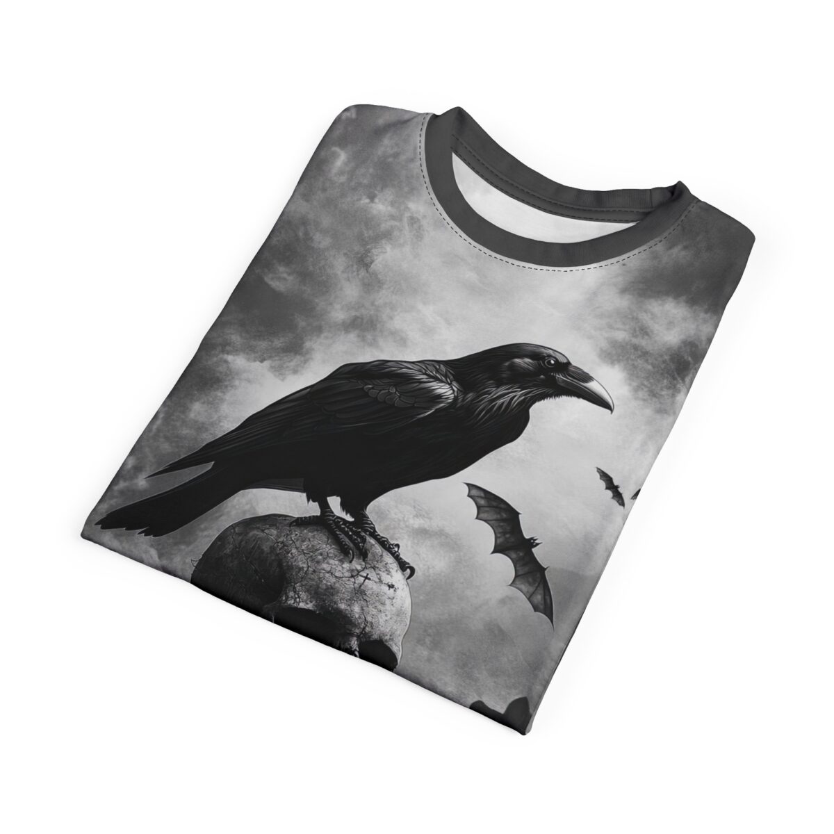 All over print sublimation tee with a detailed raven perched on a cracked skull, surrounded by flying bats and cloudy skies.