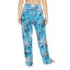 Blue pajama pants with an all over print of white and silver snowflakes. Features a seamless print design.