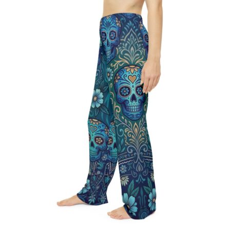 All over print pajama pants featuring a teal and blue sugar skull floral graphic, perfect for a vintage pattern streetwear aesthetic.