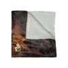 Close-up tiger face graphic throw blanket with fuzzy white sherpa lining, featuring intense orange and black striped details.