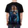 Dynamic tiger with glowing blue eyes walks through splashing water graphic on a black t-shirt.