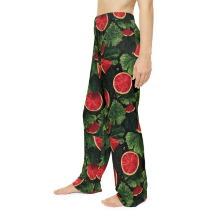 All over print pajama pants featuring a repeating pattern of sliced watermelons and green leaves on a dark background.