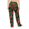 Pajama pants with a seamless all over print of vibrant red watermelon slices and lush green leaves, featuring water droplets.