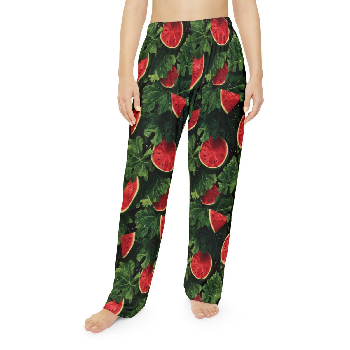 All over print pajama pants featuring a vibrant, juicy watermelon slice and green leaf pattern on a dark background. Seamless print design.