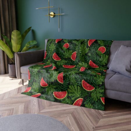 All over print fleece blanket featuring vibrant watermelon slices scattered across a dark green leafy background for a refreshing summer aesthetic.