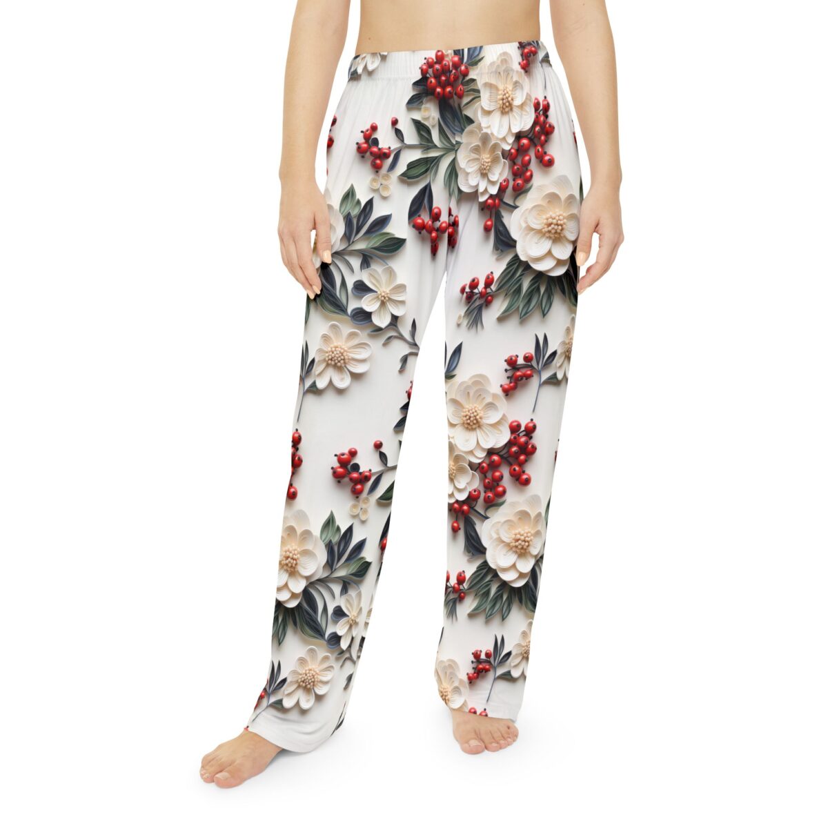 White pajama pants with a seamless all-over print of cream flowers, red berries, and green leaves.