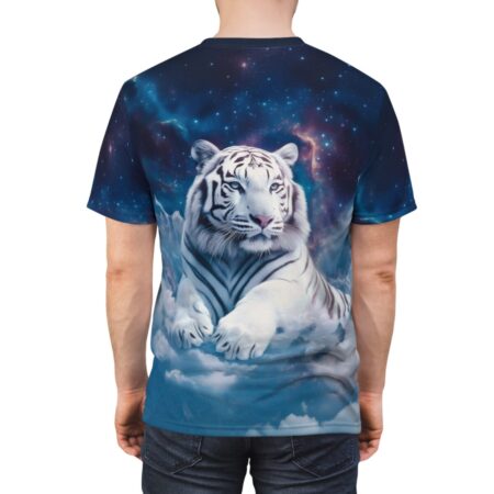 White tiger with blue eyes lying on clouds with a starry nebula background on an all over print sublimation tee.
