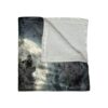 Fleece throw blanket featuring a detailed gray wolf howling at a large full moon in a spooky, dark forest setting.