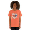Orange women's t-shirt with white 'Mama Shark' text and a blue shark graphic with a heart. Perfect for moms.