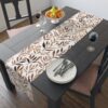 Table runner with a repeating watercolor brown leaf pattern on a white background, ideal for autumn dining and rustic home decor.