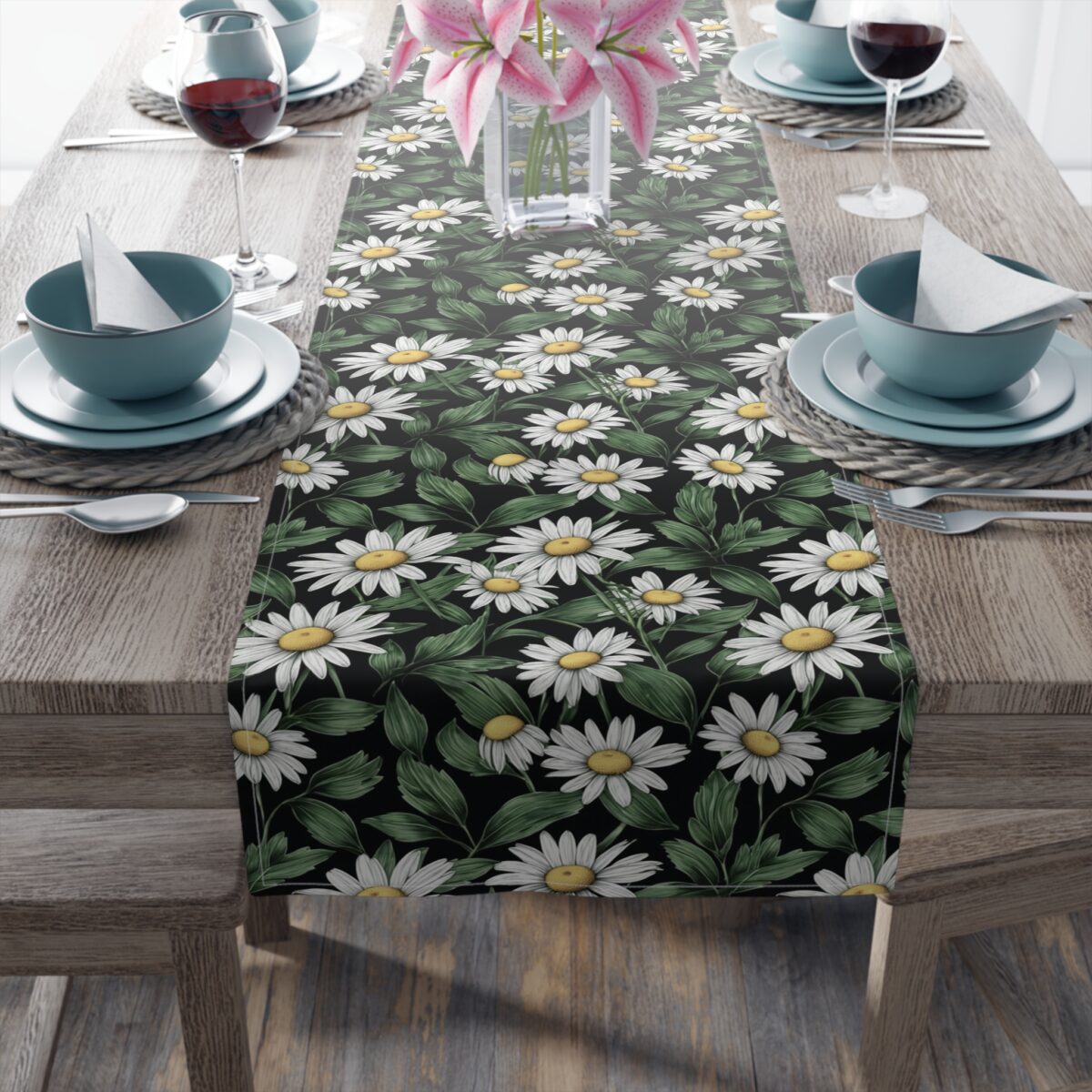Black table runner featuring a repeating white daisy floral pattern with green leaves and yellow centers, botanical print.
