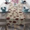 Table runner with a seamless pattern of dark red flowers and beige foliage. Perfect for vintage decor.