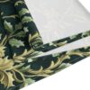 Dark green table runner with a vintage floral pattern in gold and green tones.