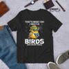 Graphic t-shirt with a cartoon yellow bird wearing sunglasses and a hat, holding binoculars, with text that says