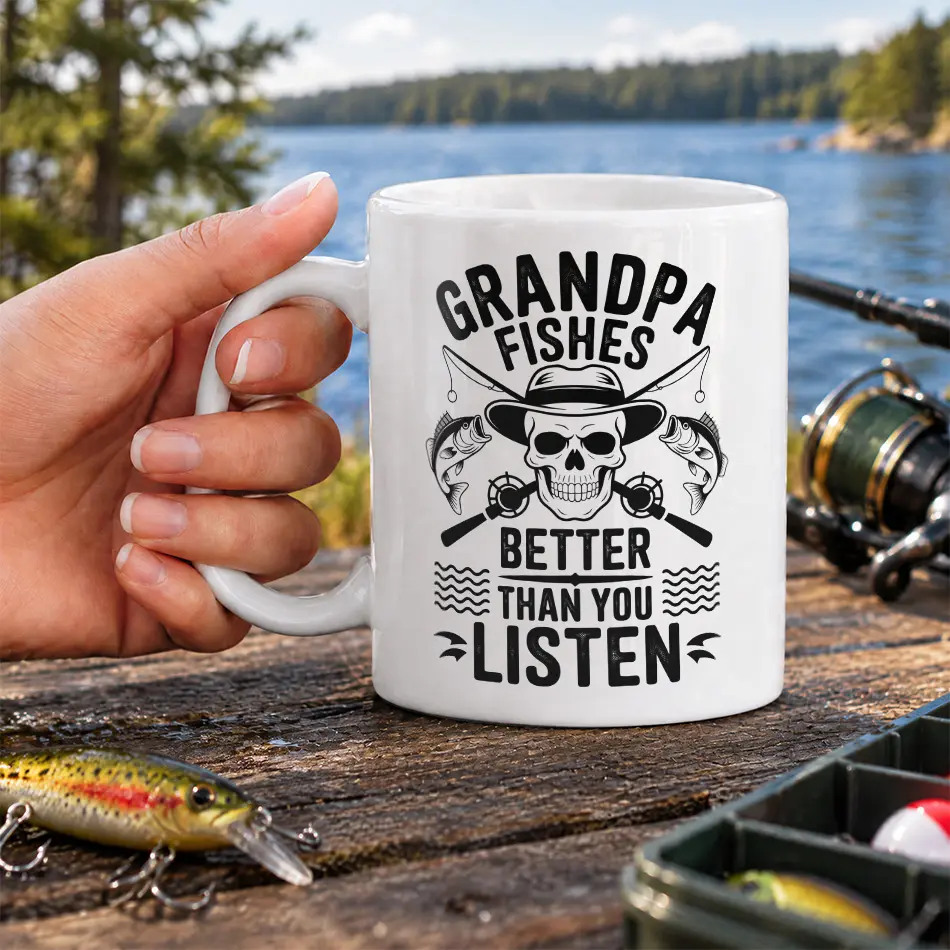 White coffee mug featuring black skull and fishing rod graphics with text reading Grandpa Fishes Better Than You Listen.