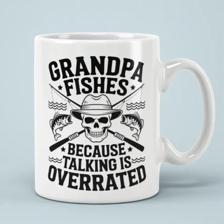 White ceramic mug featuring a skull in a fishing hat, fishing rods, and humorous text about grandpa fishing.
