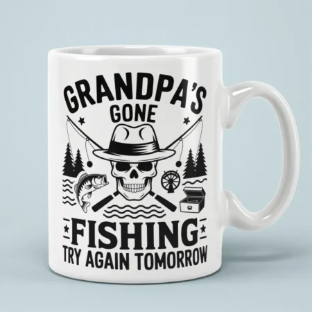 White coffee mug displaying black skull graphic with fishing hat, crossed rods, and Grandpa's Gone Fishing text.