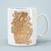 Joy to the World gingerbread cookie graphic decorates a white ceramic mug with colorful holiday icing accents.
