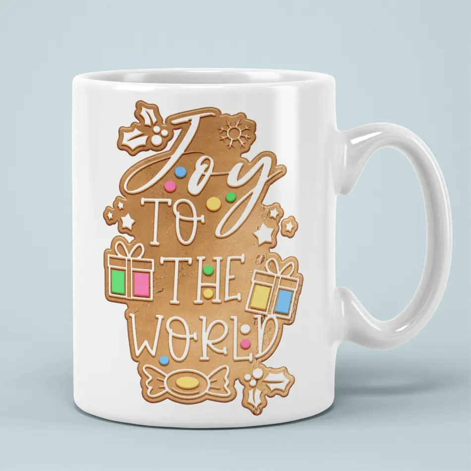 Joy to the World gingerbread cookie graphic decorates a white ceramic mug with colorful holiday icing accents.