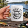 White ceramic mug featuring black dock graphic and text reading Life's Better With Dad And A Fishing Pole.