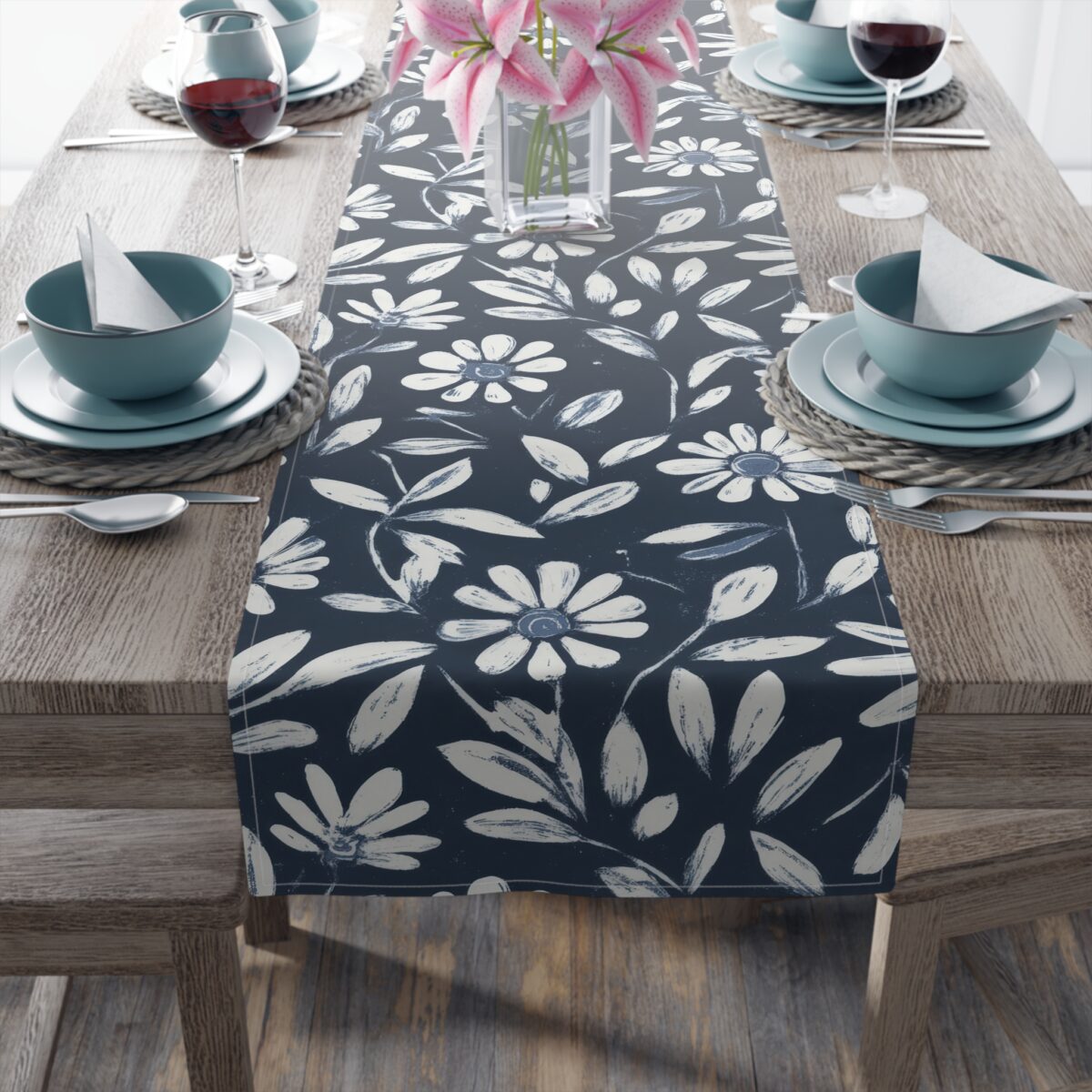 Navy blue table runner with a white daisy floral and leaf pattern, perfect for accent decor.