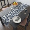 Navy and cream floral table runner with botanical print featuring large open flowers and leaves, perfect for vintage-inspired decor.