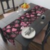 Black table runner featuring a seamless pattern of pink and white sketched hearts and swirls for Valentine's Day decor.