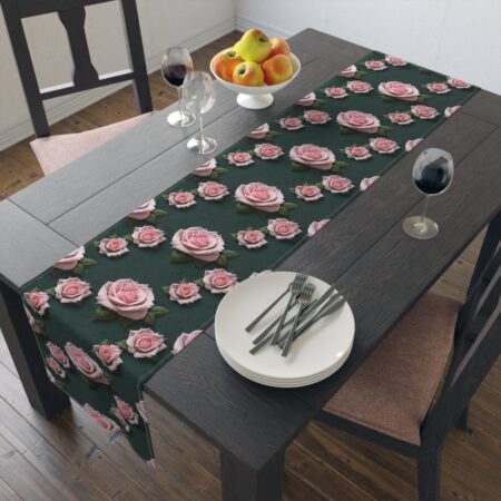 Dark green table runner featuring an all-over print of pink roses and green leaves.