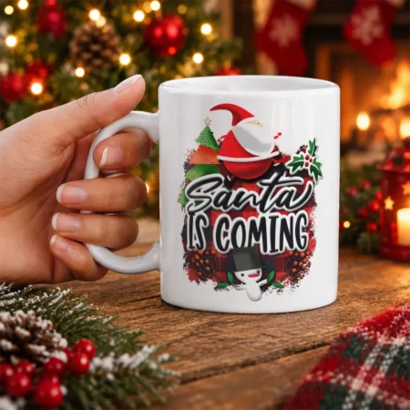 Santa Is Coming holiday ceramic mug featuring buffalo plaid, Christmas tree, and snowman artwork.