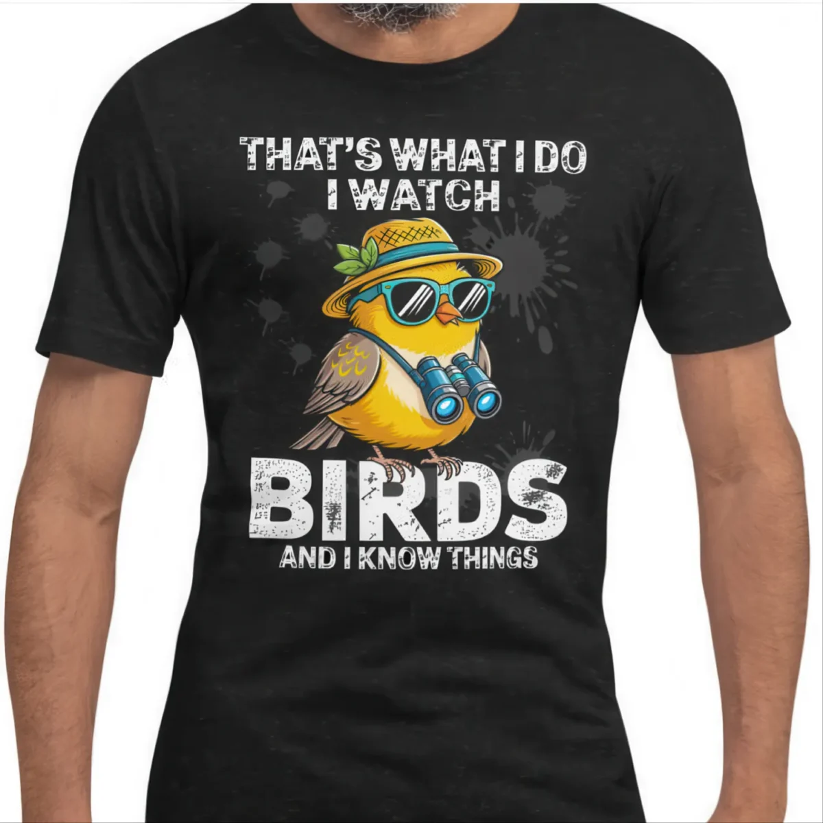 Funny yellow bird in sunglasses holding binoculars on a black graphic t-shirt with distressed text.