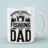 Black graphic artwork reading Weekend Forecast Fishing With Dad printed on a crisp white ceramic coffee mug.